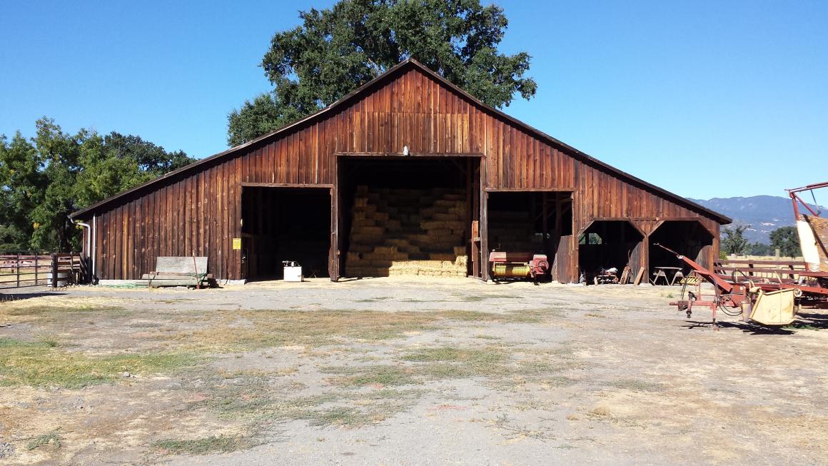 Large barn with storage and stalls